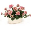 Pink Geraniums in White Lions Head Planter
