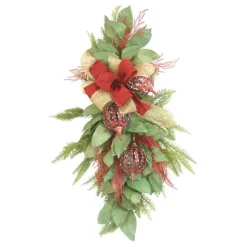 Swag Magnolia Leaves and Cedar Mixed with Red Open Weave Ornaments and Red and Gold Ribbon